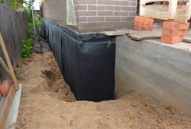 SJ Waterproofing Pros technician performing targeted Waterproofing assessment in Centreville, VA